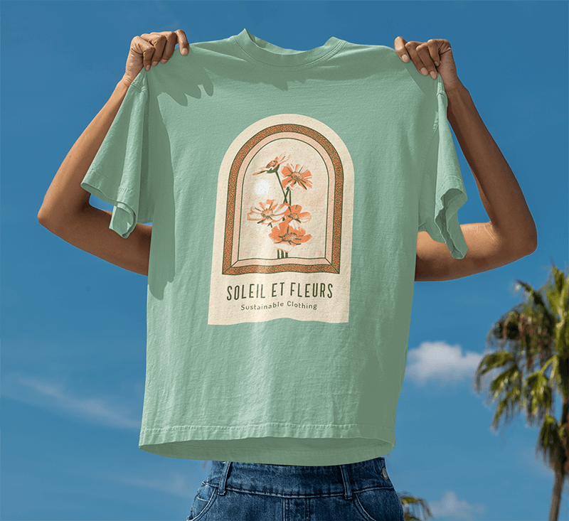 Mockup Of A Woman Holding An Oversized T Shirt Against The Sky With Palms